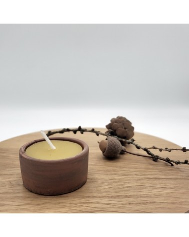 Beeswax candle in a pot