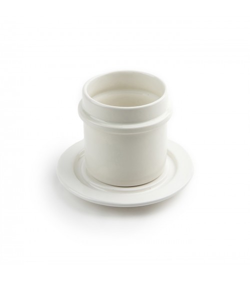 white pottery cup and saucer